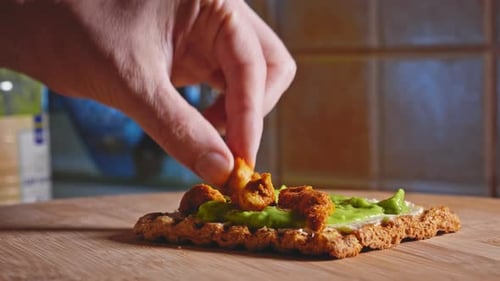Preparing Anabolic Avocado Toast Sandwich With Chicken Breast. close up