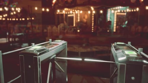 An Empty Amusement Park at Night Highlighting Vacant Rides and Dim Lights