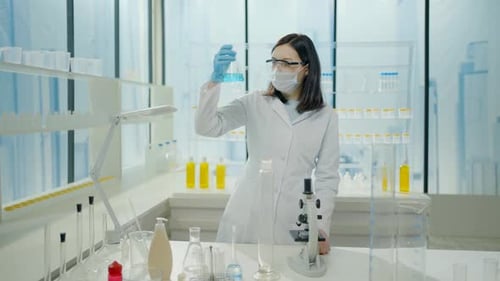 General Plan a Woman Scientist in a Mask and a White Coat in