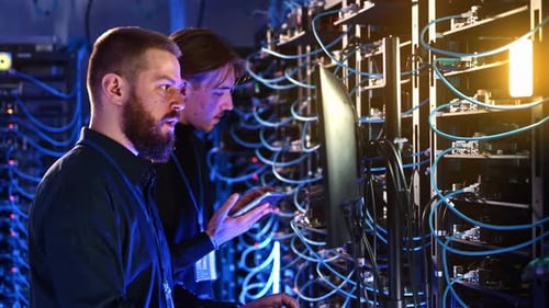 IT Professionals Working in a Modern Server Room