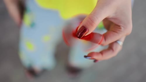 Hand Spins Red Fidget Spinner Close Up