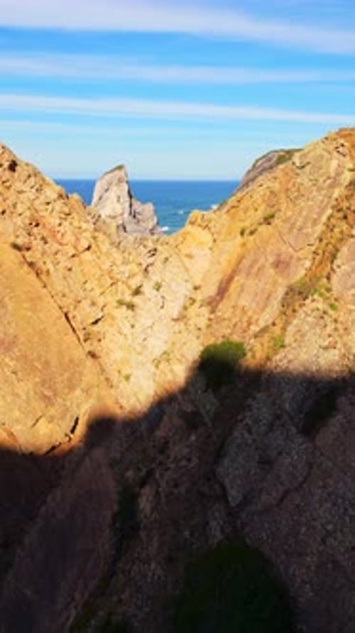 Cabo Da Roca Ursa Beach Cliffs and Atlantic Ocean Waves on Sunny Day Aerial View Portugal Vertical