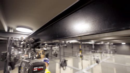 Indoor Lighting Rigging with Equipment and Person