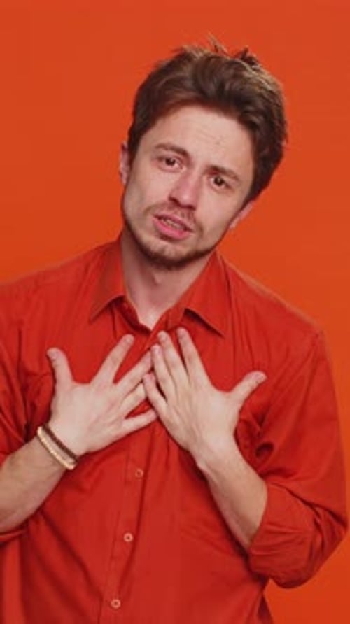 Man pleads, begs for forgiveness, looking at camera