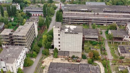 Exterior of industrial destroyed buildings. Destroyed aerial view of huge territory factory.