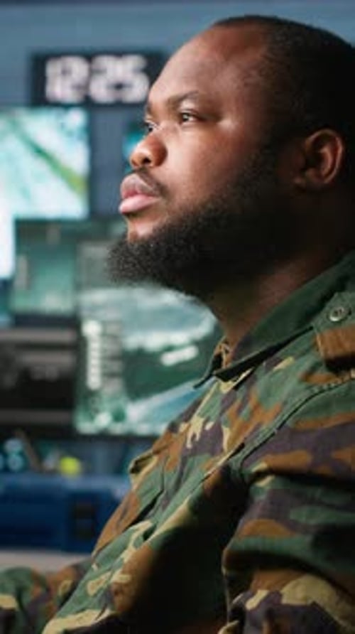 Vertical Video Man Monitoring Army HQ CCTV for Any Unauthorize Activity