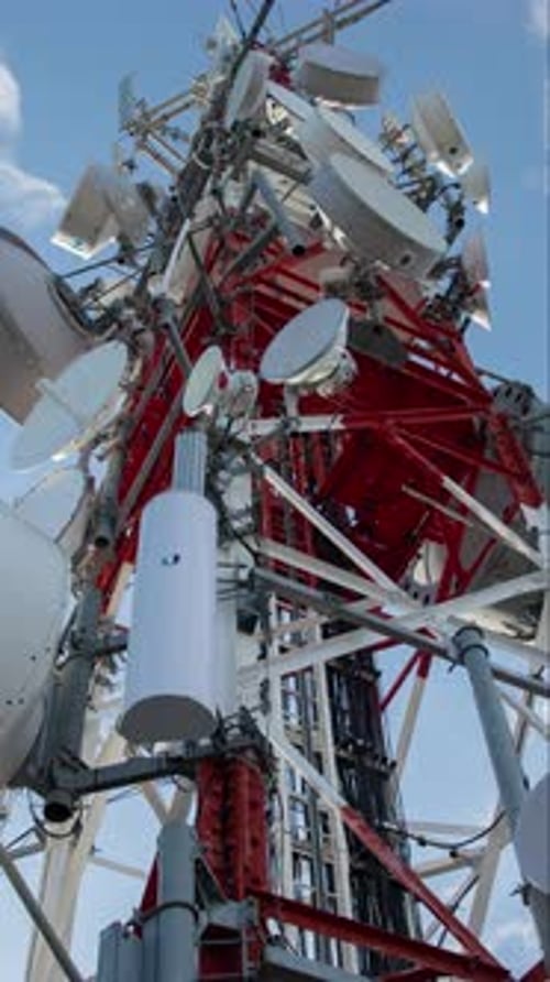 Clouds Moving in Sky Above Telecommunications Tower in Vertical