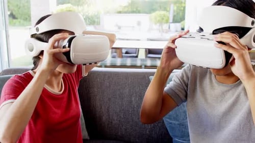 Excited Young Adults Experiencing Virtual Reality at Home