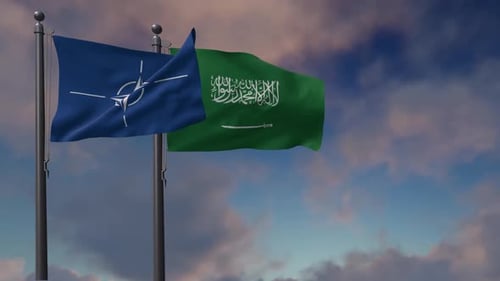 NATO and Saudi Arabia Flags Waving in Wind with Cloudy Sky