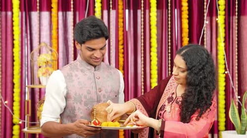 Couple Preparing Hindu Puja Tray at Home