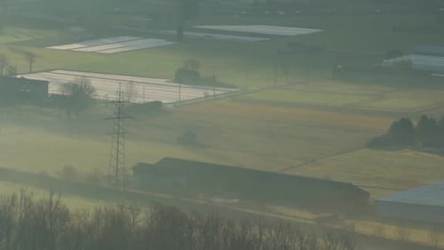 Rural Aerial View of Farm Fields and Greenhouses