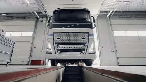 A Truck Entering The Pit At A Service Station