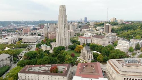 Cinematic aerial truck shot of Pitt University and Carnegie Mellon college campus scene in Oakland.