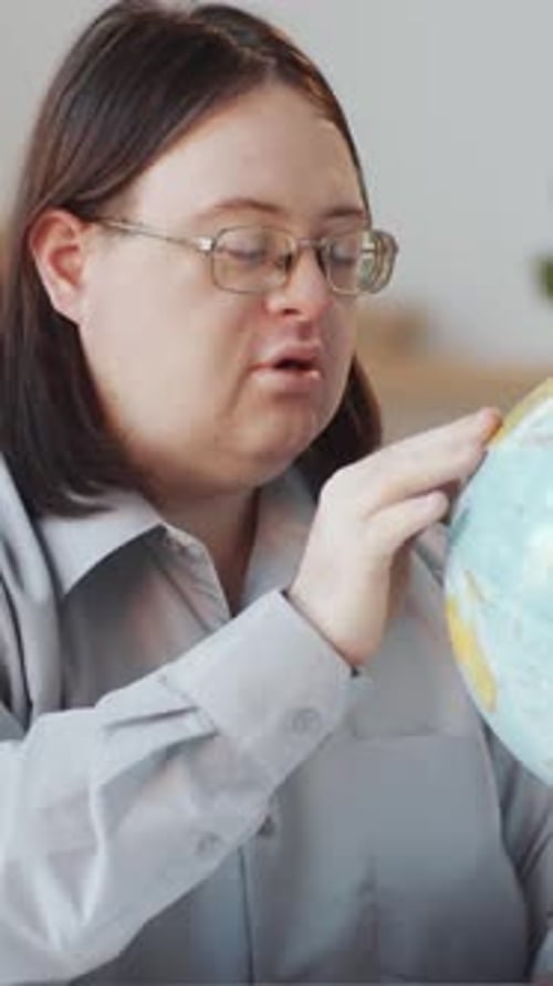 Young Adult with Globe