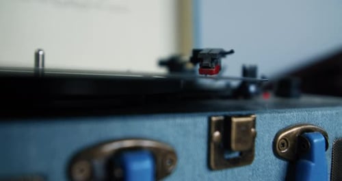 Record Spinning on Blue Turntable Close Up