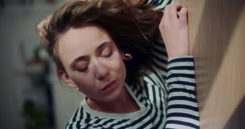 Woman Relaxing with Eyes Closed Indoors