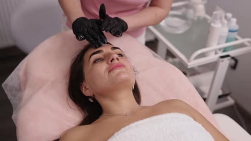 Face Skin Doctor in Gloves Cosmetology Clinic