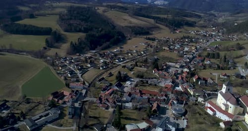 360 Degrees Drone Shot of a Village surrounded by Mountains in Austria, 4k UHD