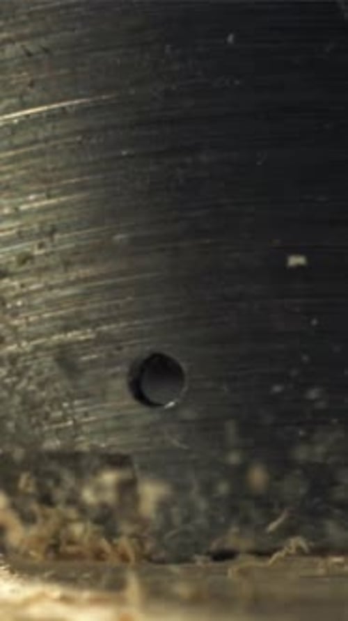 A Carpenter Drills a Hole in a Wooden Product Filmed on a Highspeed Camera at 1000 Fps