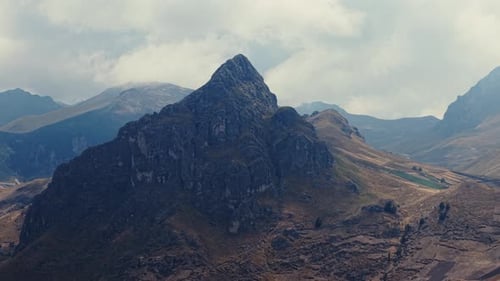 Aerial Panorama Depicting Towering Mountain Peak Nestled in Rugged Ecuadorian Andes Revealing