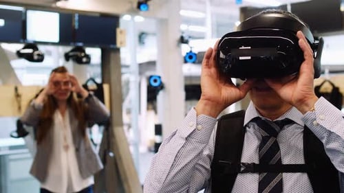 Man Experiences Virtual Reality in Modern Office Space