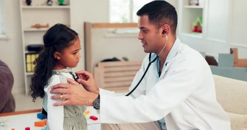 Doctor Examining Child with Stethoscope in Clinic
