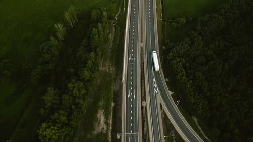 Aerial View of Highway Intersection with Moving Vehicles Realtime Birds Eye View Above Urban
