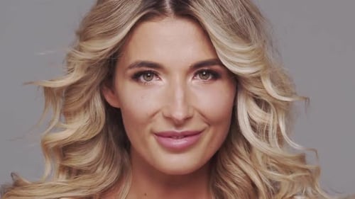 Studio Portrait of Young and Beautiful Blond Woman Over Grey Background Skin Care and Wellness