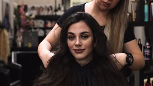 Woman Getting Hair Styled at Salon