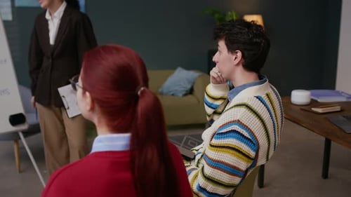 Team of Employees Analyzing Financial STrategy in Company Office