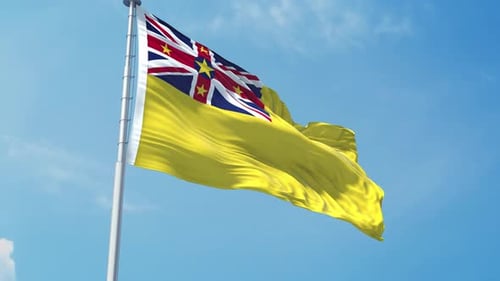 Realistic Niue National Flag Waving Against Blue Sky