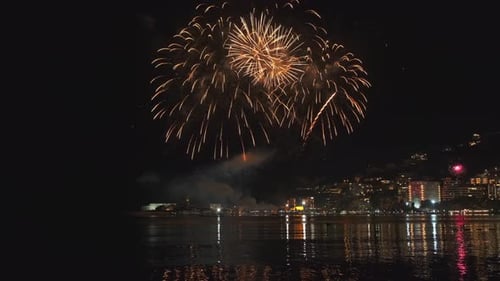 Fireworks with Colorful Lights Over Sea