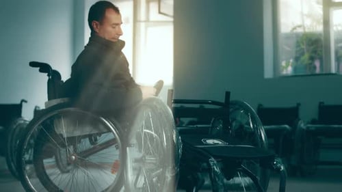 A Disabled Man Assembles a Stroller