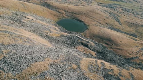 aerial view of the little lake in mountains