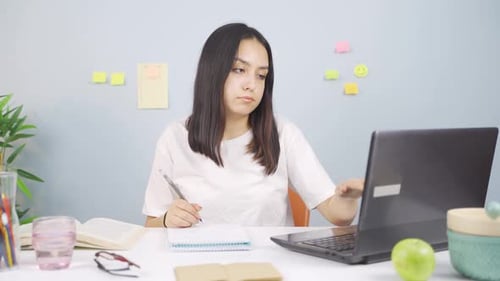 Unhappy Studying Female student.