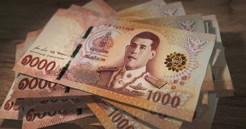 Thailand Baht 1000 money banknotes falling on the table