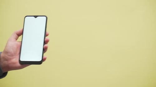 hand shows a shield with a check mark icon on a smartphone. Protection. network. security.safe.data.