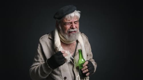 Closeup View of a Poor Caucasian Man Consuming Alcohol on the Streets