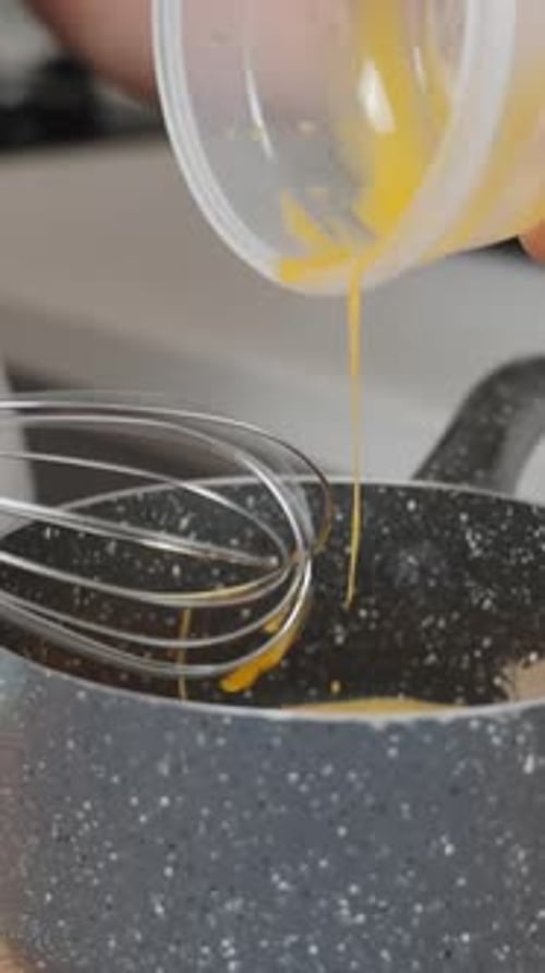 Whisking Eggs in Saucepan for Recipe
