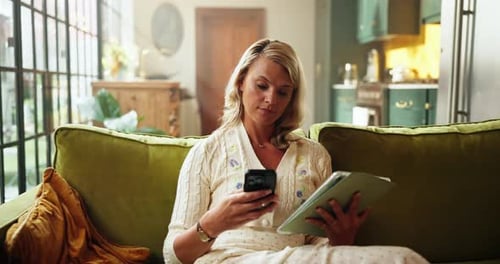 Woman Relaxing on Couch Using Phone and Tablet