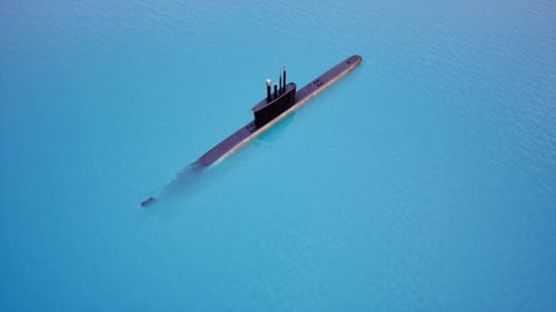 Military Submarine Cruising on Surface of Clear Blue Ocean Water, High Angle