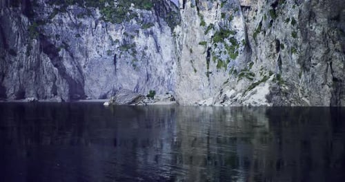 Panoramic Lake View with Majestic Cliffs Nature Motion Background