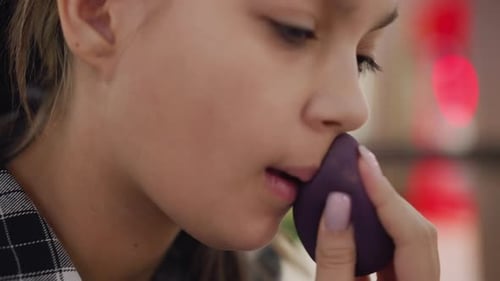 Partial View of Woman Applying Powder Around Mouth and Jaw