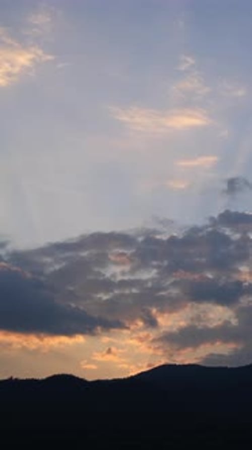 Dramatic Clouds Move at Sunrise in Time Lapse