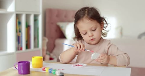 Child Concentrated on Painting at Home Art Project