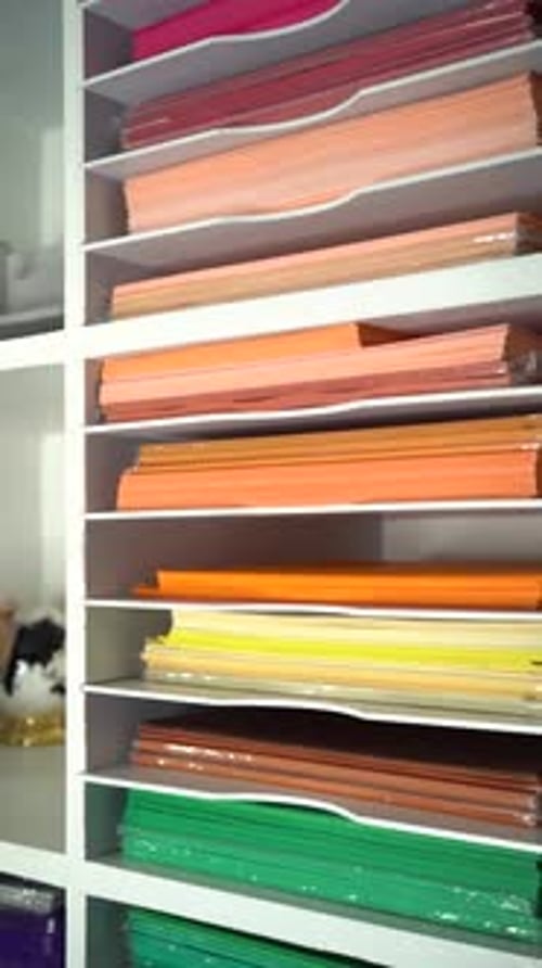 Shelving Unit Full of Stacked Colorful Paper