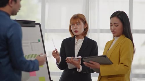 Business Team Discussing Data and Strategy in Office