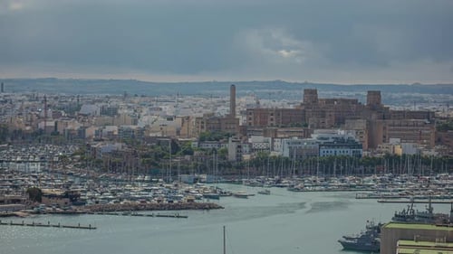 A Large Cityscape At The Coast And White Boats Sailing In The Sea In Malta