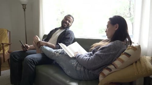 Couple Relaxing Together on Couch at Home