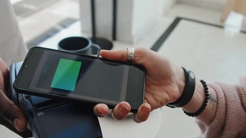Payment Process on Smartphone Touching Terminal in Cafe